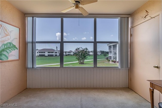 1624 Pine Valley Dr Unit 212, Fort Myers, FL 33907 - carpeted spare room featuring a textured wall, plenty of natural light, and ceiling fan