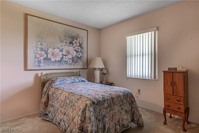 1624 Pine Valley Dr Unit 212, Fort Myers, FL 33907 - carpeted bedroom with baseboards and a textured ceiling