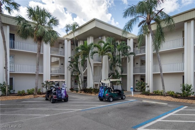 1624 Pine Valley Dr Unit 212, Fort Myers, FL 33907 - view of property with uncovered parking