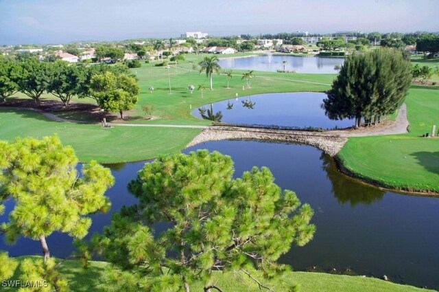 1624 Pine Valley Dr Unit 212, Fort Myers, FL 33907 - drone / aerial view with a water view and view of golf course