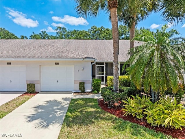 20657 Country Barn Dr, Estero, FL 33928 - ranch-style home featuring a shingled roof, stucco siding, concrete driveway, and a garage