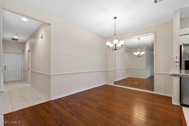 20657 Country Barn Dr, Estero, FL 33928 - unfurnished dining area featuring baseboards, a chandelier, recessed lighting, visible vents, and hardwood / wood-style floors
