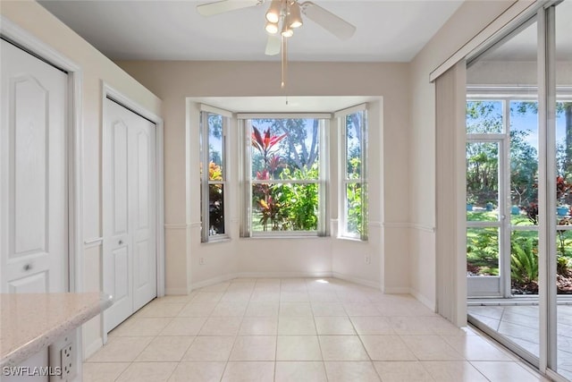 20657 Country Barn Dr, Estero, FL 33928 - interior space featuring ceiling fan, baseboards, and light tile patterned flooring