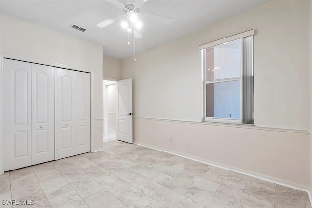 20657 Country Barn Dr, Estero, FL 33928 - unfurnished bedroom with visible vents, baseboards, a ceiling fan, and a closet