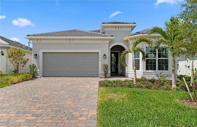 7060 Del Webb Oak Creek Blvd, North Fort Myers, FL 33917 - mediterranean / spanish house with decorative driveway, a garage, stucco siding, and a tile roof