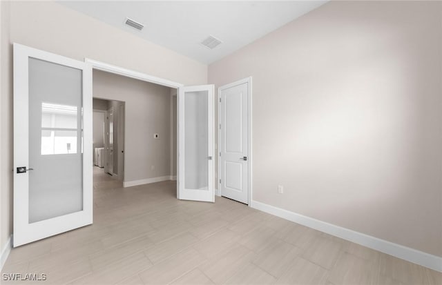 7060 Del Webb Oak Creek Blvd, North Fort Myers, FL 33917 - unfurnished bedroom with baseboards and light flooring