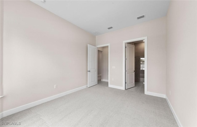 7060 Del Webb Oak Creek Blvd, North Fort Myers, FL 33917 - unfurnished bedroom featuring light colored carpet and baseboards