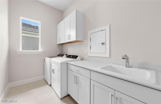 7060 Del Webb Oak Creek Blvd, North Fort Myers, FL 33917 - laundry area with cabinet space, separate washer and dryer, and baseboards