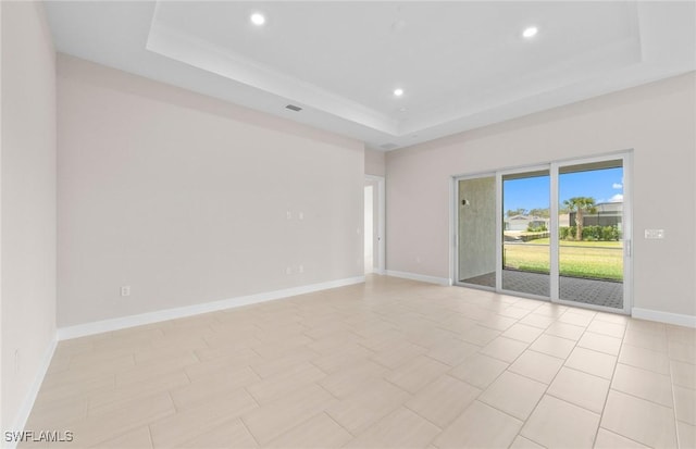 7060 Del Webb Oak Creek Blvd, North Fort Myers, FL 33917 - spare room featuring a raised ceiling, recessed lighting, and baseboards