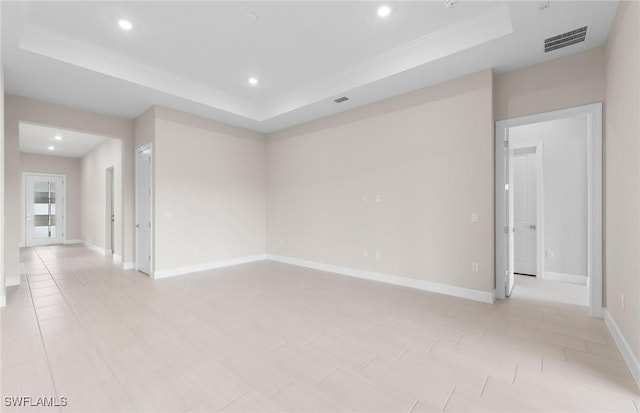 7060 Del Webb Oak Creek Blvd, North Fort Myers, FL 33917 - empty room with a tray ceiling, recessed lighting, and baseboards