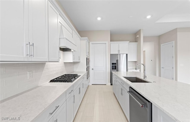 7060 Del Webb Oak Creek Blvd, North Fort Myers, FL 33917 - kitchen featuring a sink, appliances with stainless steel finishes, white cabinets, light stone countertops, and tasteful backsplash