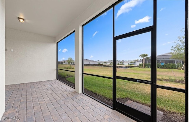 7060 Del Webb Oak Creek Blvd, North Fort Myers, FL 33917 - unfurnished sunroom with a residential view
