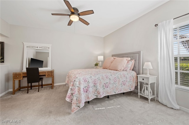 bedroom with carpet floors, baseboards, and a ceiling fan