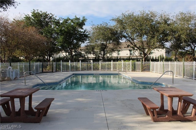 14870 Pleasant Bay Ln Unit 1208, Naples, FL 34119 - community pool featuring a patio area