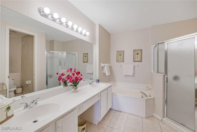full bath featuring a sink, a stall shower, tile patterned floors, and toilet