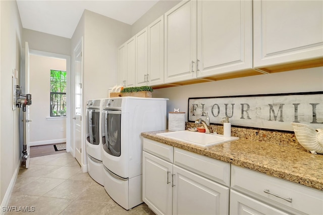 14501 Marsala Way, Naples, FL 34109 - laundry area featuring separate washer and dryer, cabinet space, and light tile patterned floors