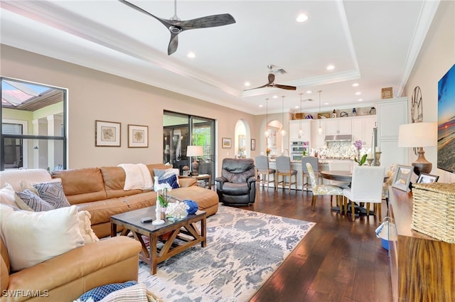 14501 Marsala Way, Naples, FL 34109 - living area with a ceiling fan, crown molding, a tray ceiling, dark wood-type flooring, and recessed lighting