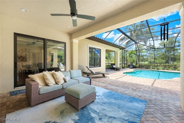 14501 Marsala Way, Naples, FL 34109 - swimming pool with ceiling fan, a patio, an outdoor hangout area, and a lanai