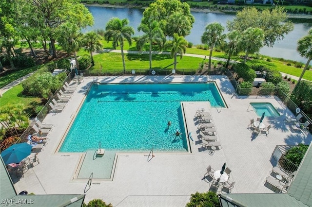 7099 Pond Cypress Ct Unit 102, Naples, FL 34109 - community pool featuring a water view and a patio