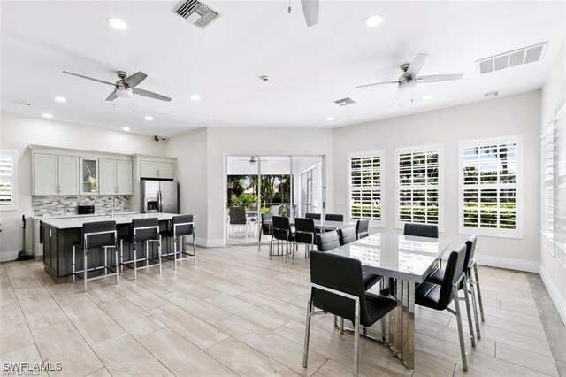 7099 Pond Cypress Ct Unit 102, Naples, FL 34109 - dining area with ceiling fan, recessed lighting, baseboards, and light wood finished floors