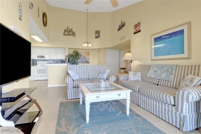 1150 Wildwood Lakes Blvd Unit 306, Naples, FL 34104 - living area with visible vents, light tile patterned floors, ceiling fan with notable chandelier, and a high ceiling