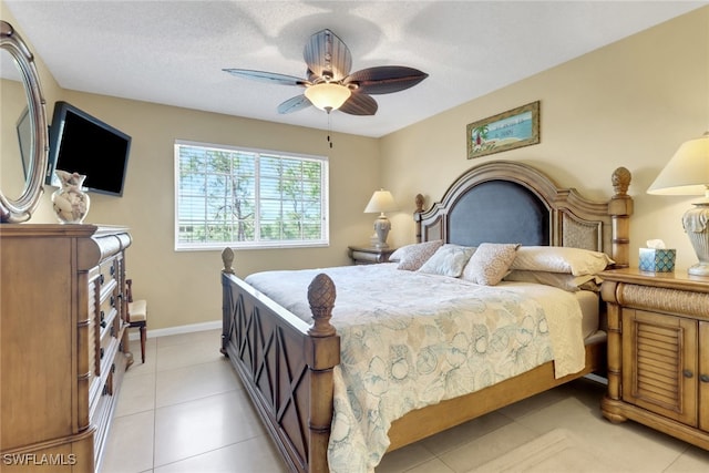 1150 Wildwood Lakes Blvd Unit 306, Naples, FL 34104 - bedroom with baseboards, light tile patterned floors, and ceiling fan