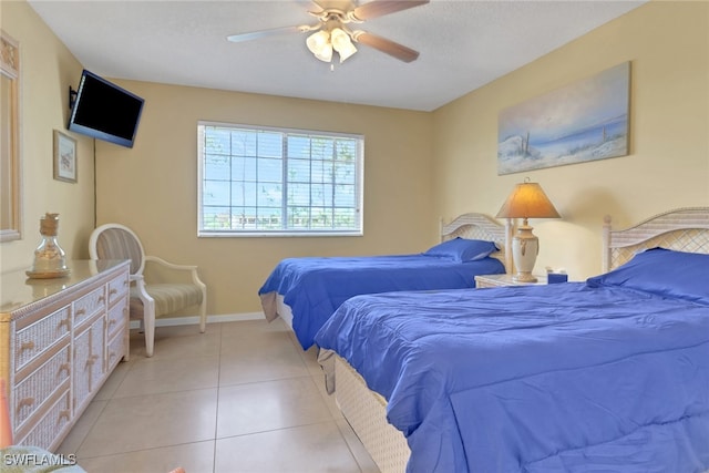 1150 Wildwood Lakes Blvd Unit 306, Naples, FL 34104 - bedroom featuring tile patterned floors, ceiling fan, and baseboards