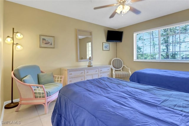1150 Wildwood Lakes Blvd Unit 306, Naples, FL 34104 - tiled bedroom featuring a ceiling fan and baseboards