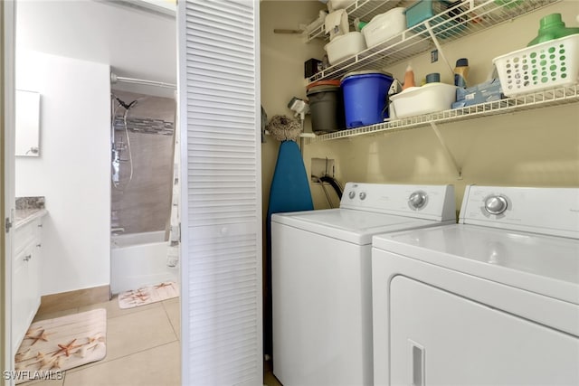 1150 Wildwood Lakes Blvd Unit 306, Naples, FL 34104 - laundry area with light tile patterned floors, laundry area, and independent washer and dryer