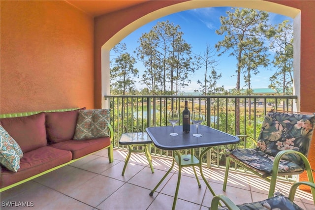 1150 Wildwood Lakes Blvd Unit 306, Naples, FL 34104 - balcony with outdoor lounge area and a water view