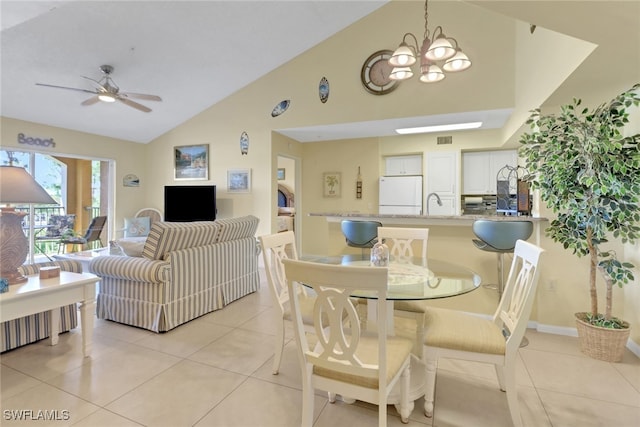 1150 Wildwood Lakes Blvd Unit 306, Naples, FL 34104 - dining space with light tile patterned floors, visible vents, high vaulted ceiling, and ceiling fan with notable chandelier