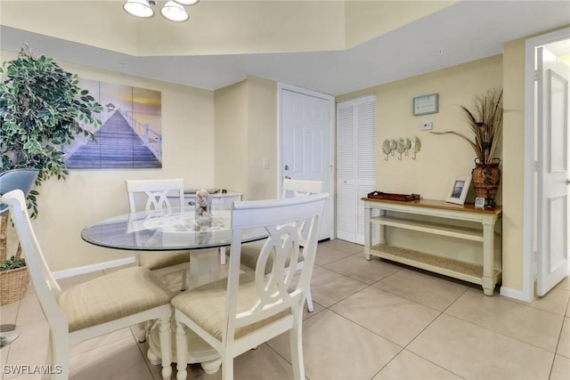 1150 Wildwood Lakes Blvd Unit 306, Naples, FL 34104 - dining space featuring light tile patterned floors and baseboards