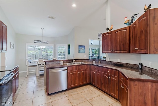 kitchen with a sink, stainless steel appliances, light tile patterned floors, visible vents, and dark countertops