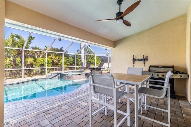 view of swimming pool featuring area for grilling, a patio area, a lanai, ceiling fan, and a pool with connected hot tub