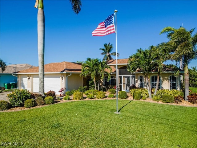 2951 SW 30th St, Cape Coral, FL 33914 - view of front of property featuring a garage, stucco siding, a front yard, and driveway