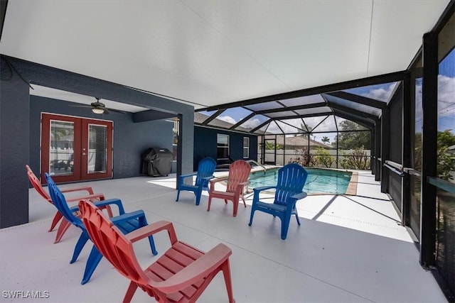 3322 SW 29th Ave, Cape Coral, FL 33914 - pool featuring a ceiling fan, grilling area, glass enclosure, a patio, and french doors