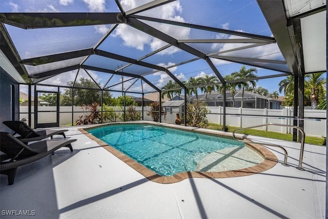 3322 SW 29th Ave, Cape Coral, FL 33914 - view of swimming pool with a fenced backyard, a fenced in pool, a patio area, and glass enclosure
