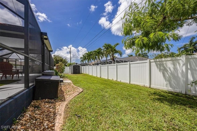 3322 SW 29th Ave, Cape Coral, FL 33914 - view of yard with an outdoor structure, a patio area, a fenced backyard, a storage shed, and glass enclosure