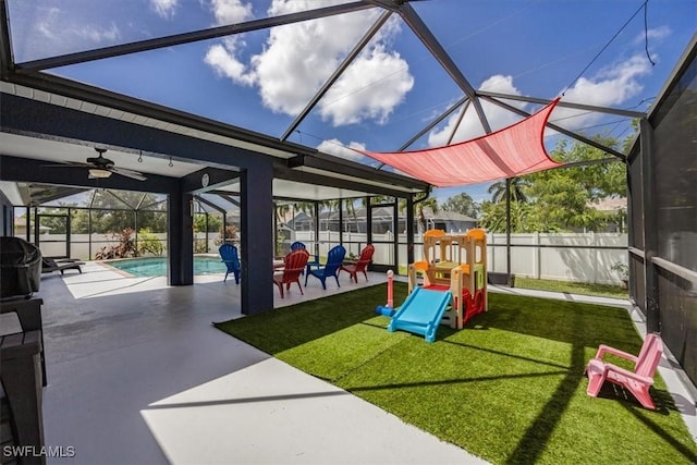 3322 SW 29th Ave, Cape Coral, FL 33914 - communal playground featuring a fenced backyard, a lawn, glass enclosure, a patio, and a fenced in pool