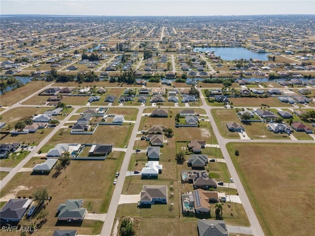 2112 NE 4th Place, Cape Coral, FL 33909 - aerial overview of property's location featuring nearby suburban area and a large body of water