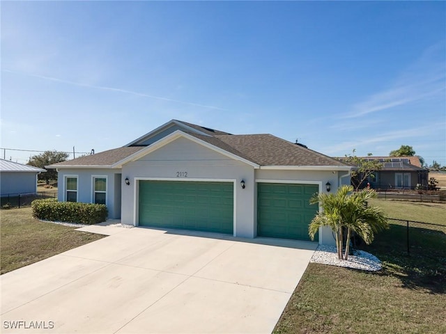2112 NE 4th Place, Cape Coral, FL 33909 - single story home featuring an attached garage, driveway, stucco siding, and roof with shingles