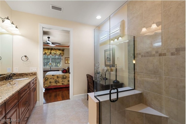 full bathroom featuring tile patterned flooring, visible vents, vanity, connected bathroom, and a stall shower