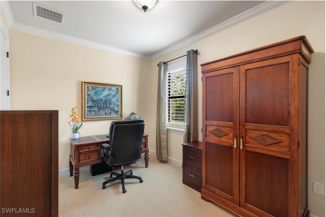 office with baseboards, visible vents, light colored carpet, and ornamental molding