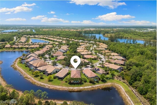 bird's eye view with a residential view and a water view