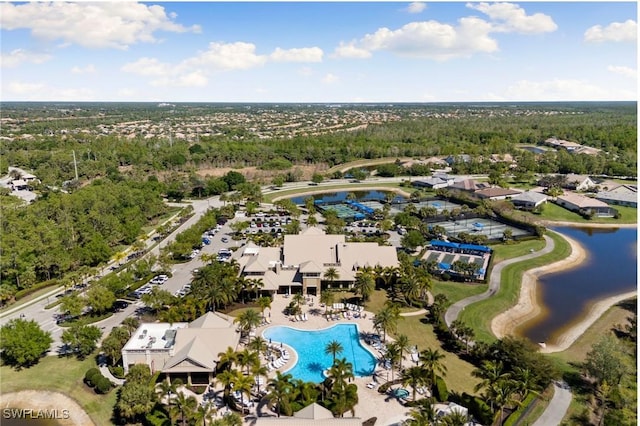 bird's eye view featuring a residential view, a view of trees, and a water view