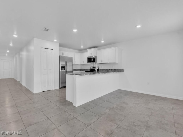 1512 NW 31st Ave, Cape Coral, FL 33993 - kitchen with stainless steel appliances, recessed lighting, a peninsula, light tile patterned floors, and visible vents