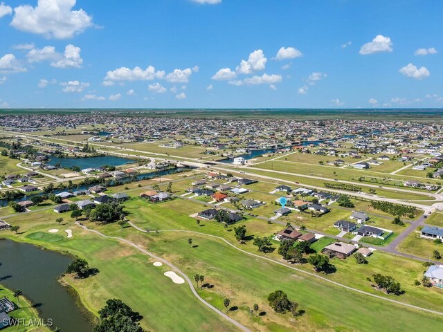 1512 NW 31st Ave, Cape Coral, FL 33993 - birds eye view of property with a residential view, view of golf course, and a water view