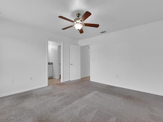 1512 NW 31st Ave, Cape Coral, FL 33993 - unfurnished bedroom featuring carpet floors, a ceiling fan, baseboards, and ensuite bath