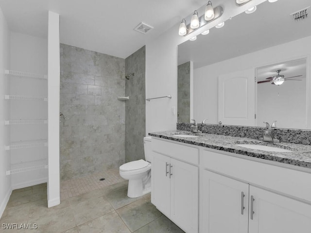 1512 NW 31st Ave, Cape Coral, FL 33993 - bathroom with ceiling fan, visible vents, and a sink