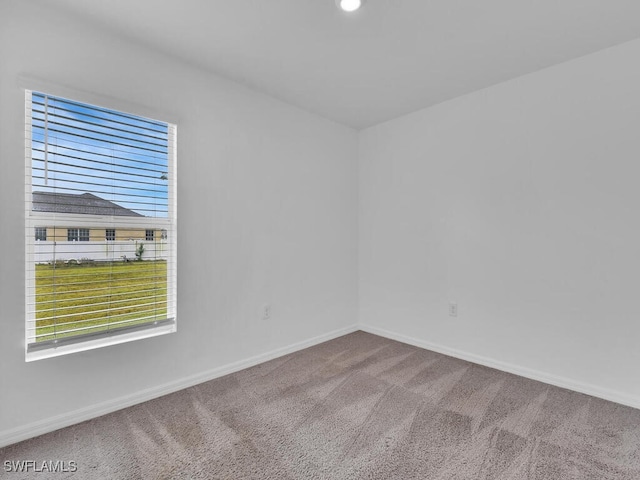 1512 NW 31st Ave, Cape Coral, FL 33993 - carpeted empty room with baseboards and recessed lighting